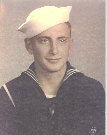 Robert Wolford wearing a U.S. Navy uniform and white cap.