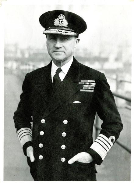 A black-and-white photograph of Admiral Sir Bertram Home Ramsey wearing a naval uniform with epaulettes, standing confidently.