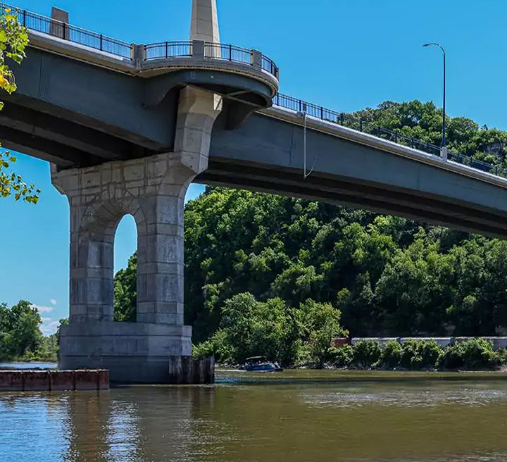 The Eisenhower Bridge of Valor crossing above a tree-lined roadway.