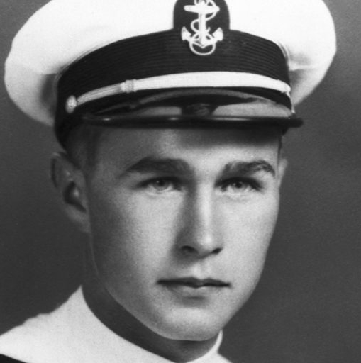 George Bush wearing a white peaked cap in a formal portrait.