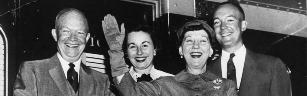 Members of the Eisenhower family smiling and waving together.