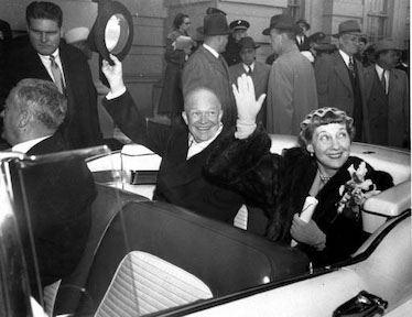 Dwight D. Eisenhower raises his hat beside Mamie Eisenhower on Inauguration Day.